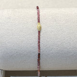 Red Spinel and 18K Gold charm clasp bracelet