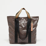 Jack Gomme Escape Calvi Tote in Root - Big Bag NY A brown tote with both short handles and long shoulder straps
 with an outside pocket for phone or water  bottle.