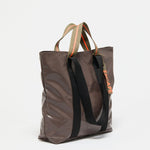 Jack Gomme Escape Calvi Tote in Root - Big Bag NY A brown tote with both short handles and long shoulder straps
 with an outside pocket for phone or water  bottle.